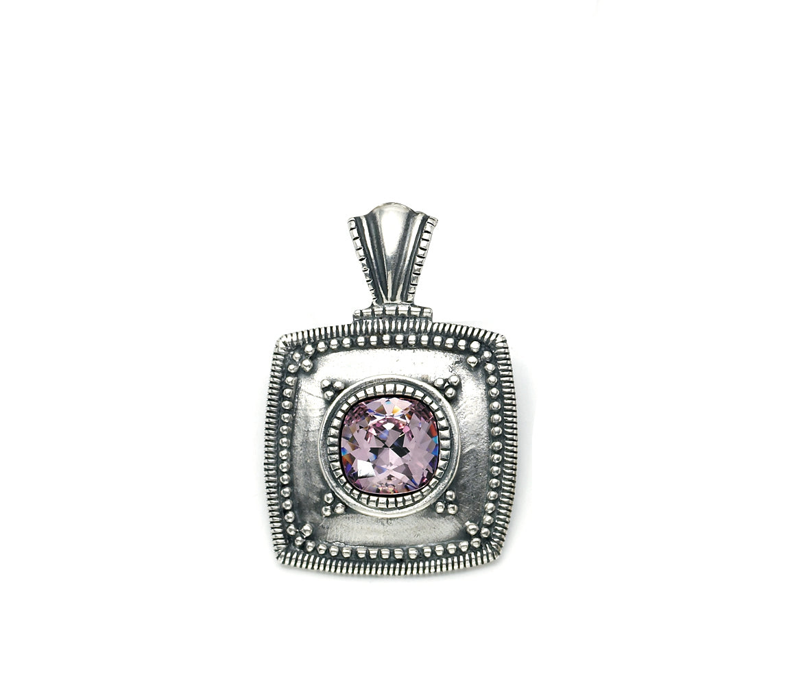 Silver Square pendant with a purple gemstone in the centre on a white background