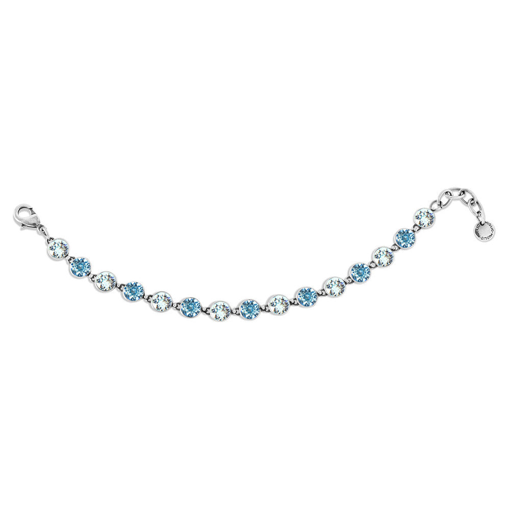 Silver Tennis bracelet with blue gemstones on a white background