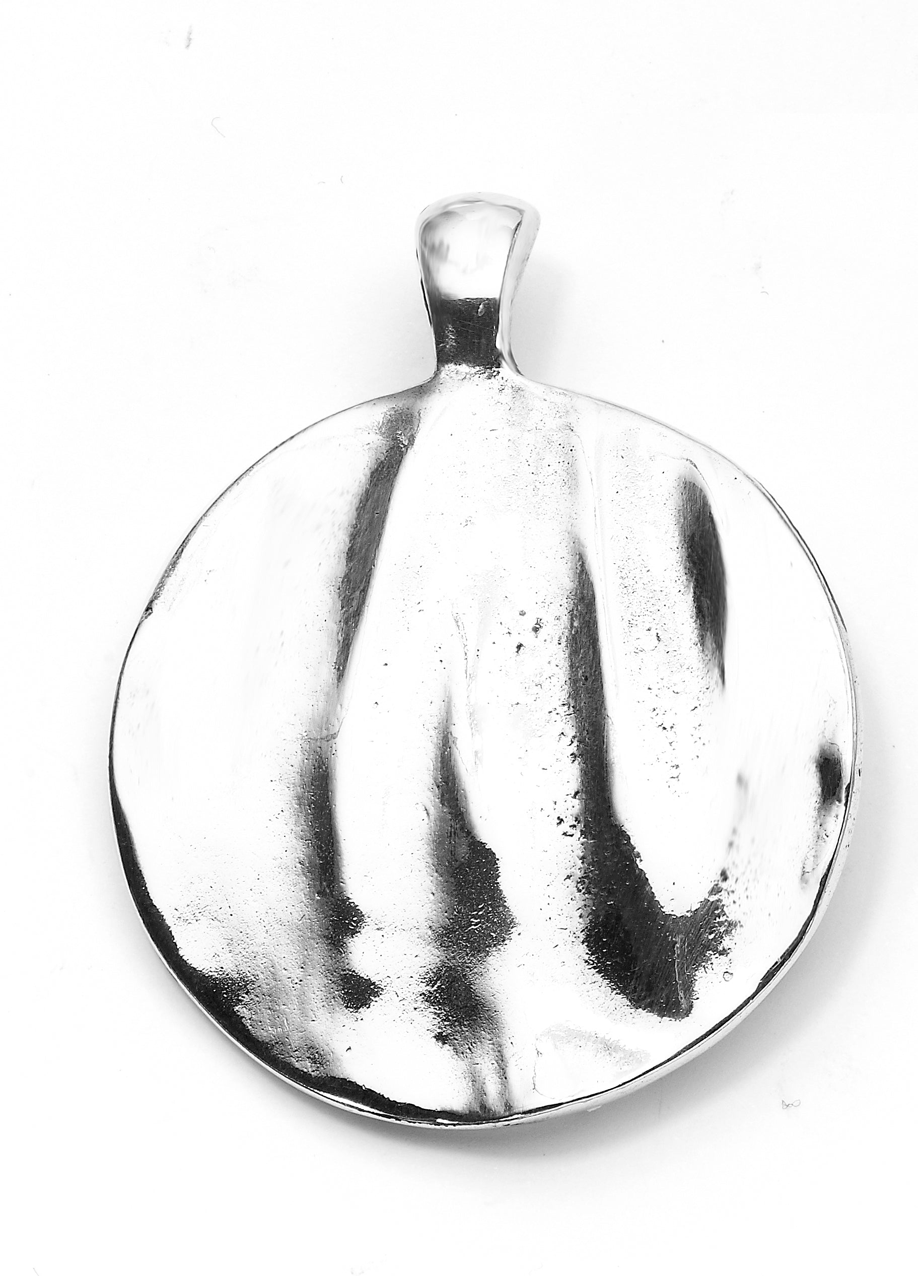 Silver large round pendant with a organic, rippled texture across its polished silver-look surface on a white background